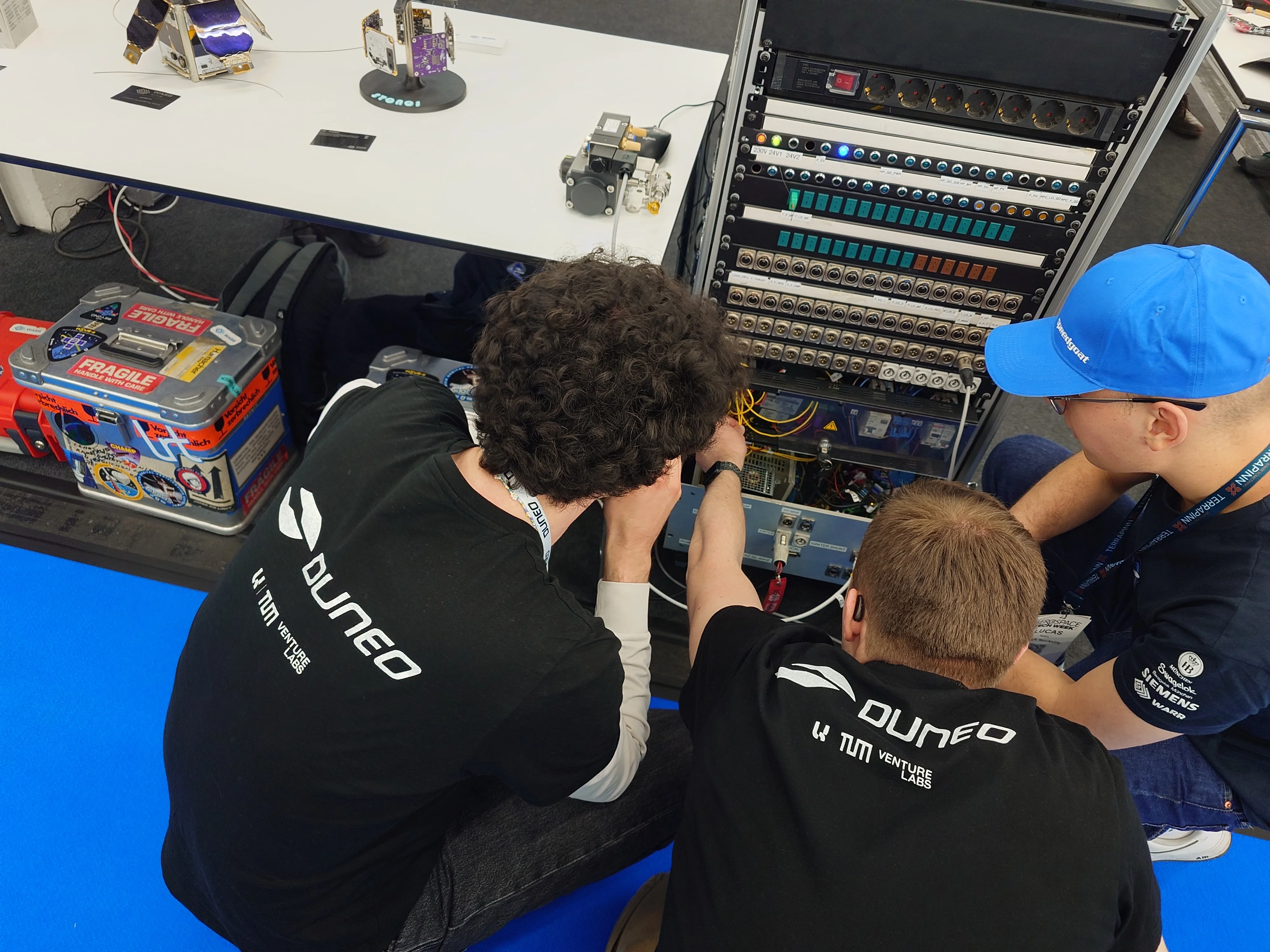 Duneo's Josh and Fabian inspecting product prototypes.